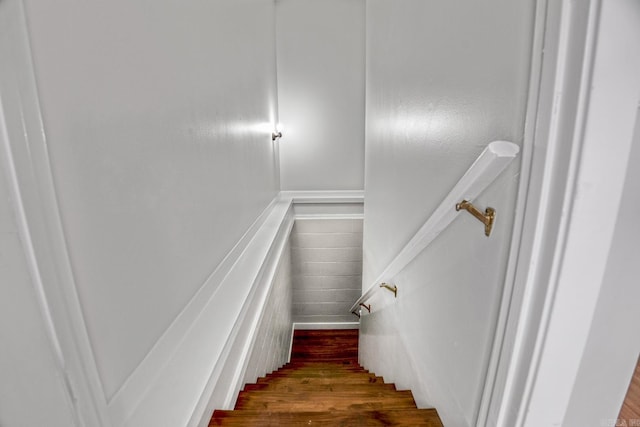 stairway with wood finished floors