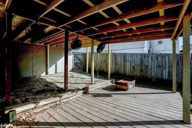 wooden terrace featuring fence