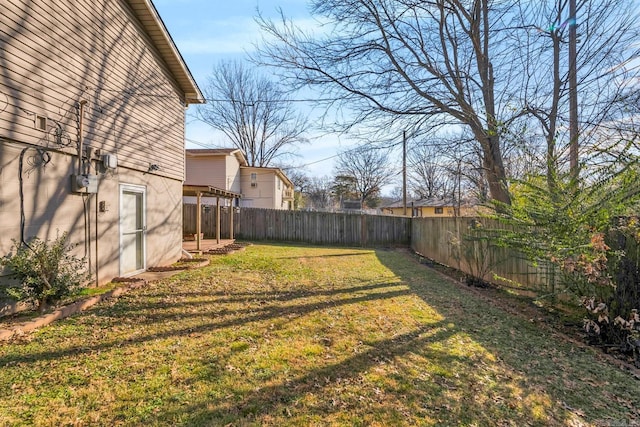 view of yard with a fenced backyard