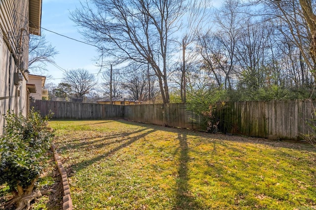 view of yard featuring a fenced backyard