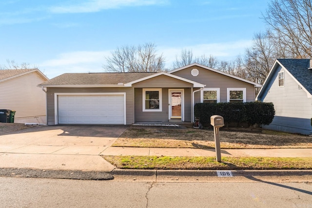 view of front of home with a garage and driveway