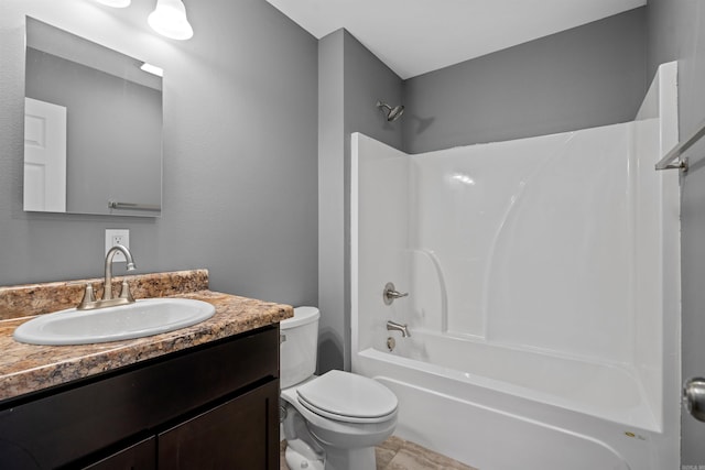 full bathroom featuring toilet, bathtub / shower combination, and vanity