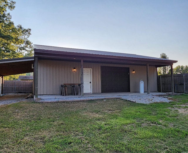 garage with driveway and fence