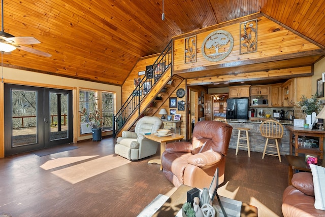 living area with wooden ceiling, stairway, french doors, and high vaulted ceiling