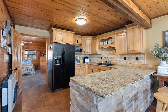 kitchen with stainless steel microwave, wooden ceiling, a peninsula, black refrigerator with ice dispenser, and a sink