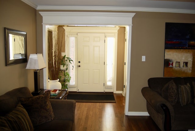 foyer entrance with baseboards, dark wood-style floors, and crown molding