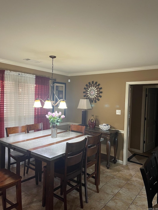 dining area featuring light tile patterned floors, baseboards, a chandelier, and crown molding