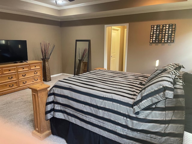 bedroom featuring crown molding, baseboards, and carpet floors