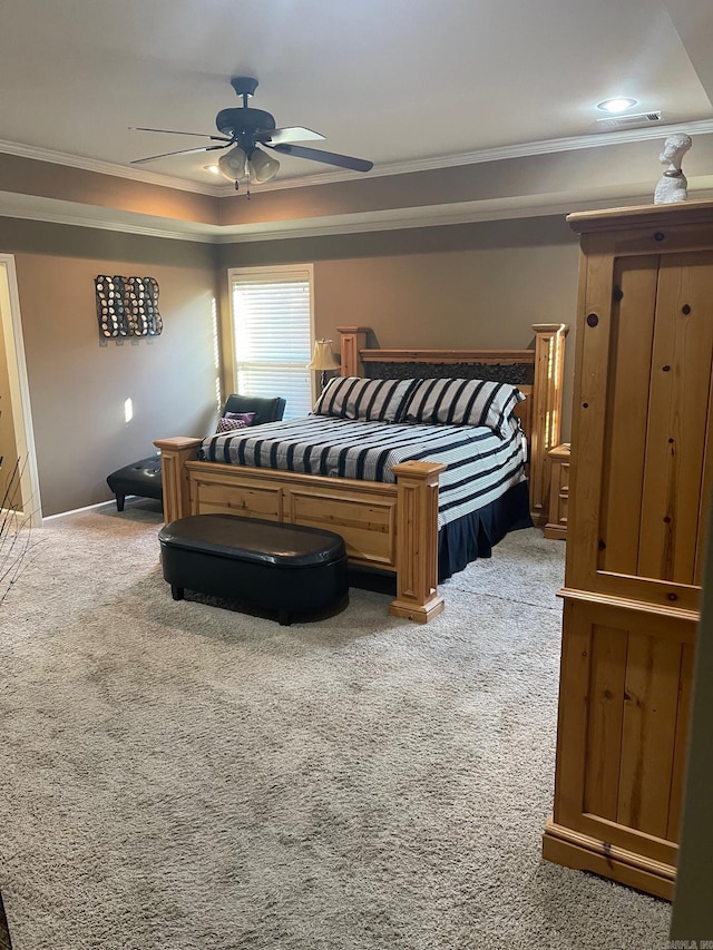 bedroom with ceiling fan, light colored carpet, and ornamental molding