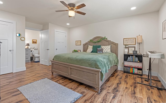 bedroom with a ceiling fan, recessed lighting, wood finished floors, and baseboards