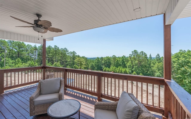 wooden terrace featuring ceiling fan