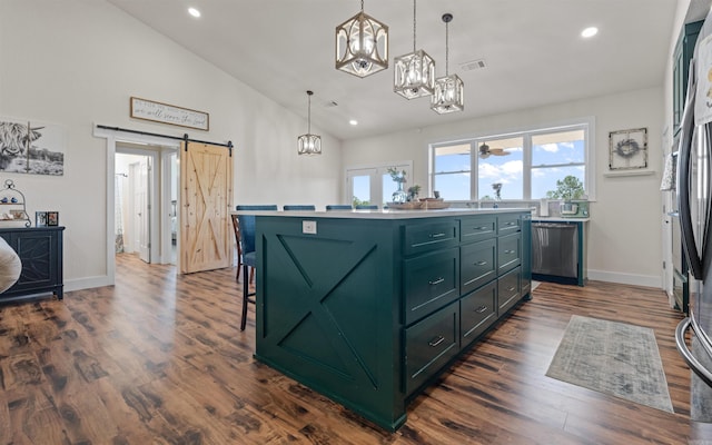 kitchen with visible vents, a chandelier, a barn door, stainless steel dishwasher, and green cabinetry