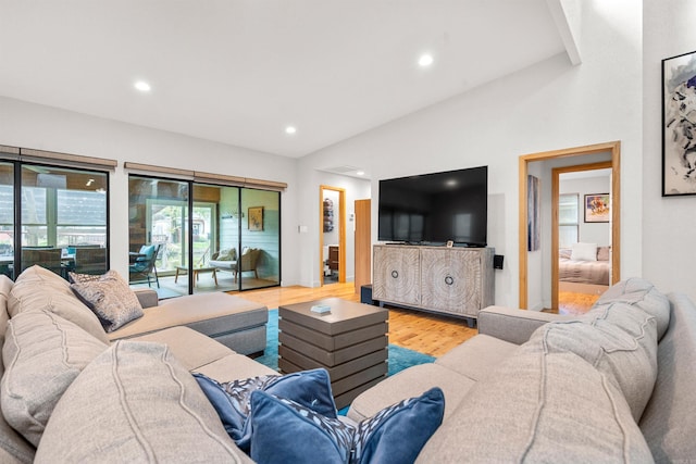 living area with recessed lighting and wood finished floors