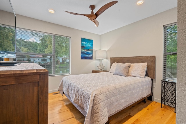 bedroom featuring recessed lighting, light wood-style flooring, and baseboards