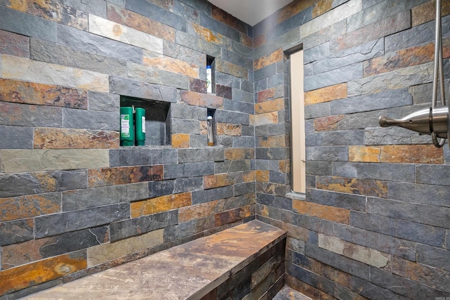 bathroom with a tile shower