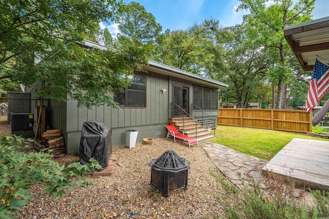 view of yard featuring entry steps and fence