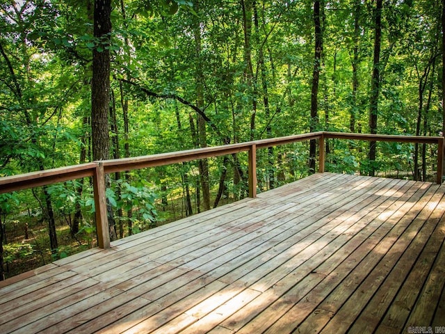 deck featuring a forest view