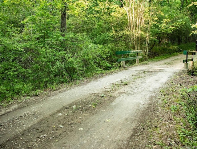 view of street featuring a forest view