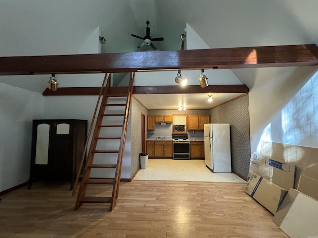 kitchen featuring range with electric cooktop, wallpapered walls, freestanding refrigerator, light wood-style floors, and brown cabinetry