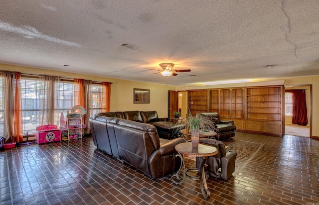 106 Pine Forest Ln, Fordyce, AR 71742 - living area featuring brick floor, visible vents, and a ceiling fan