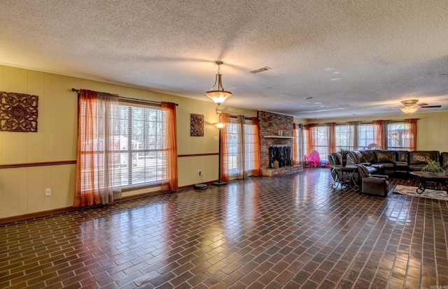 106 Pine Forest Ln, Fordyce, AR 71742 - living room with plenty of natural light, brick patterned floor, and a large fireplace