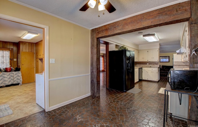 106 Pine Forest Ln, Fordyce, AR 71742 - kitchen with black fridge, a textured ceiling, light countertops, and ceiling fan