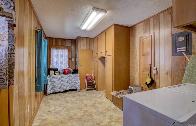 106 Pine Forest Ln, Fordyce, AR 71742 - bedroom with wooden walls, light floors, and a textured ceiling