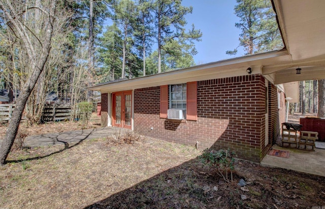 106 Pine Forest Ln, Fordyce, AR 71742 - exterior space with french doors, brick siding, and fence