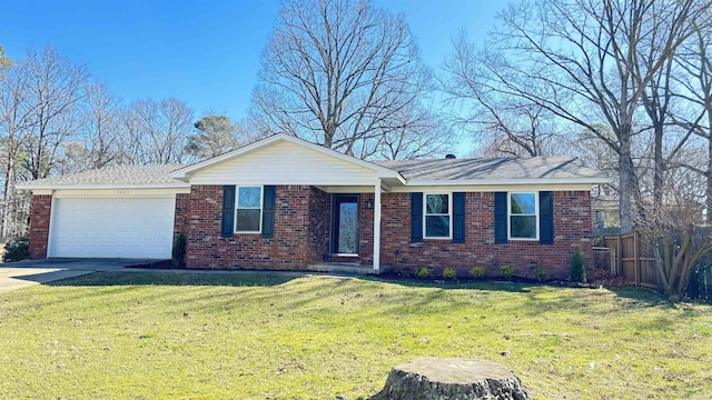 single story home with brick siding, a front lawn, fence, driveway, and an attached garage