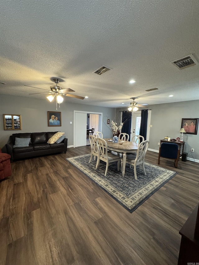 700 Thompson St, Mcgehee, AR 71654 - dining space featuring visible vents, baseboards, dark wood-style floors, and ceiling fan