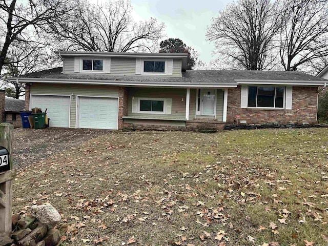 view of front of property with a front lawn and brick siding