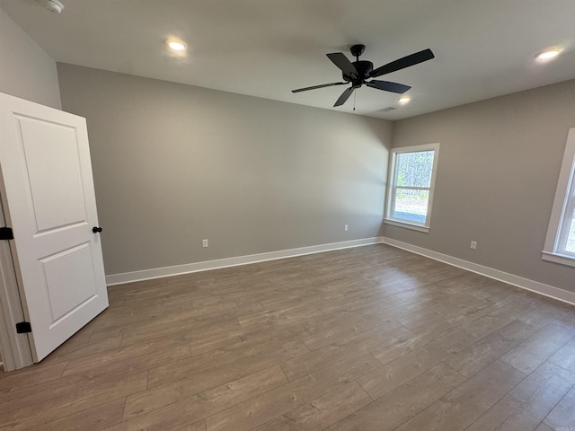 unfurnished room featuring recessed lighting, baseboards, dark wood-type flooring, and ceiling fan