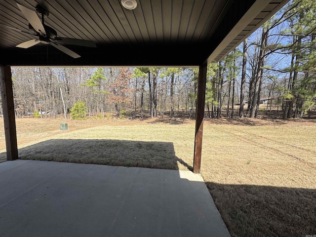 view of yard featuring a ceiling fan and a patio area