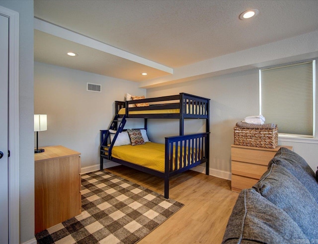 bedroom featuring recessed lighting, baseboards, visible vents, and light wood finished floors
