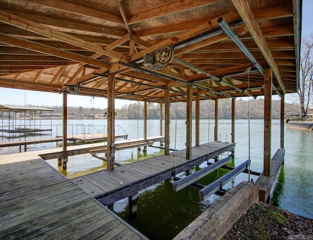 view of dock with a water view and boat lift