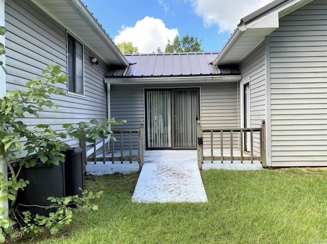 240 Timberlane Dr, Magnolia, AR 71753 - entrance to property with metal roof and a lawn