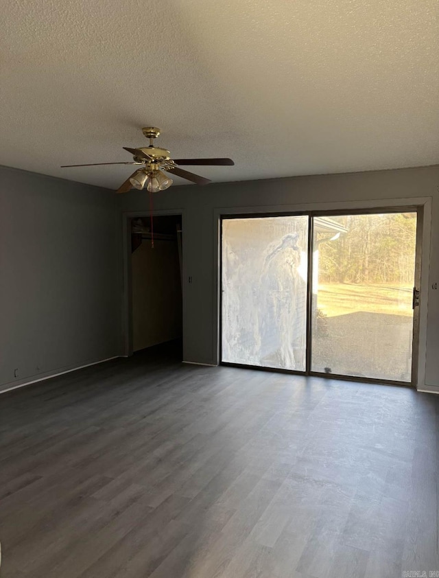 240 Timberlane Dr, Magnolia, AR 71753 - empty room with a textured ceiling, wood finished floors, and ceiling fan