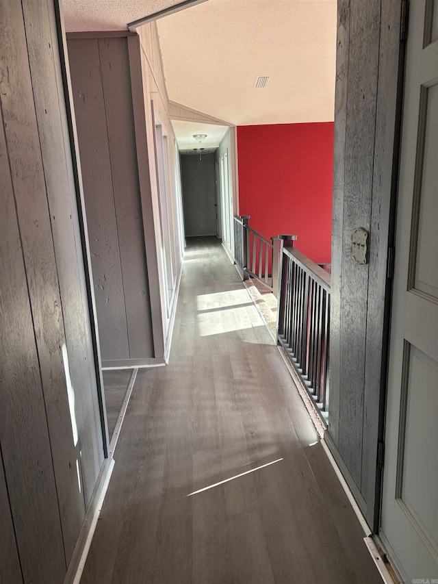 240 Timberlane Dr, Magnolia, AR 71753 - hall featuring an upstairs landing, wood finished floors, and visible vents