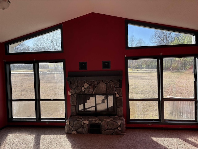 240 Timberlane Dr, Magnolia, AR 71753 - carpeted living room featuring a stone fireplace and vaulted ceiling
