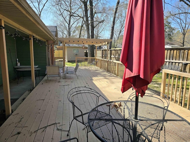 wooden terrace featuring outdoor dining area