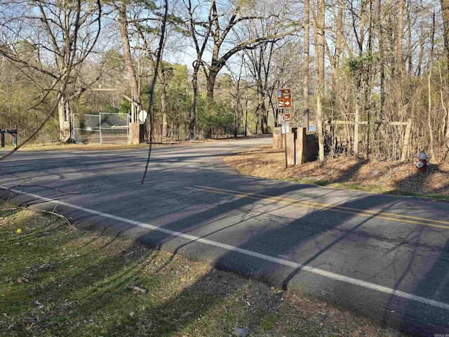 view of road featuring a gate
