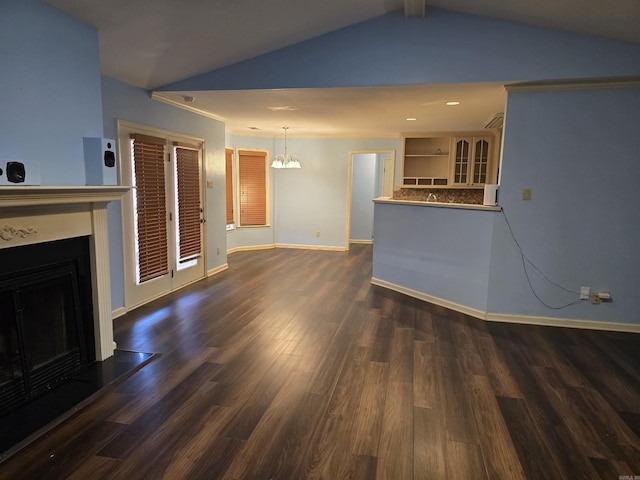 unfurnished living room featuring dark wood-type flooring, a fireplace, baseboards, and vaulted ceiling
