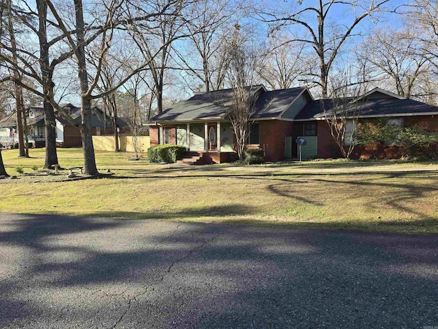 view of front of property with a front lawn