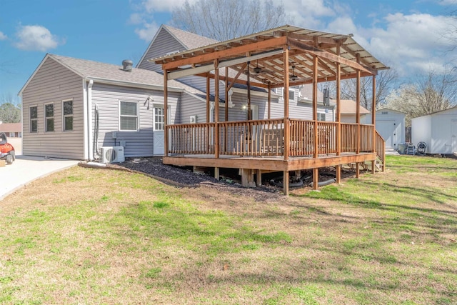 exterior space featuring ac unit, an outbuilding, a lawn, a storage shed, and roof with shingles