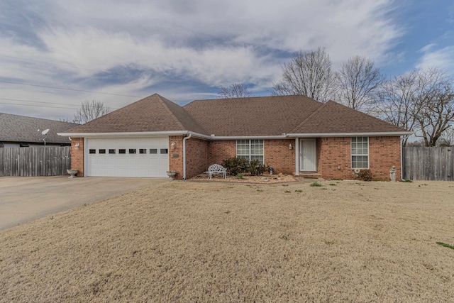 ranch-style house featuring concrete driveway, an attached garage, fence, and brick siding