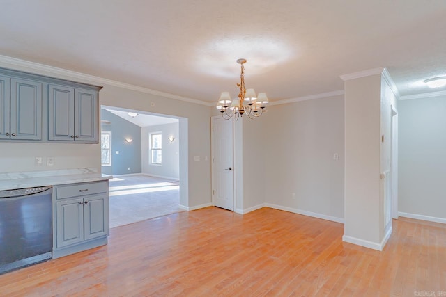 unfurnished dining area featuring light wood finished floors, a notable chandelier, baseboards, and ornamental molding