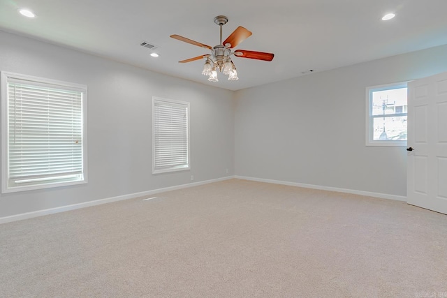 unfurnished room featuring recessed lighting, visible vents, light colored carpet, and baseboards