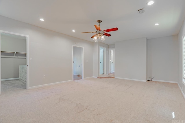 unfurnished bedroom featuring light colored carpet, visible vents, recessed lighting, and baseboards