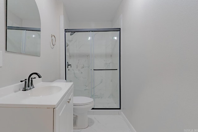 full bath featuring a marble finish shower, toilet, marble finish floor, and vanity