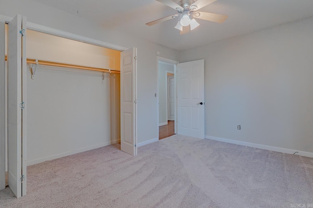 unfurnished bedroom with a ceiling fan, baseboards, a closet, and carpet floors
